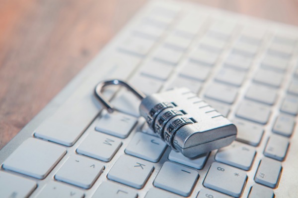 sasun-bughdaryan-WUJmdr8pNwk-unsplash.jpg Sasun bughdaryan WUJmdr8pNwk unsplash. A computer keyboard with a combination lock resting on it